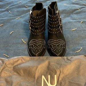 Black beaded heeled boots.